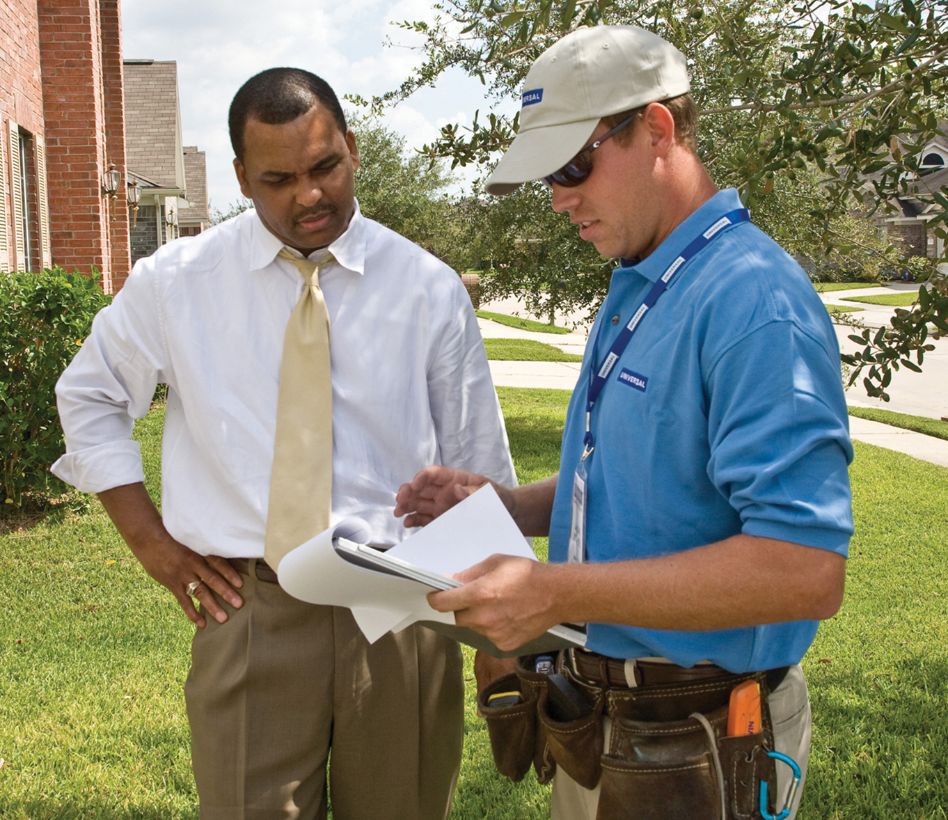 man conferring with contractor